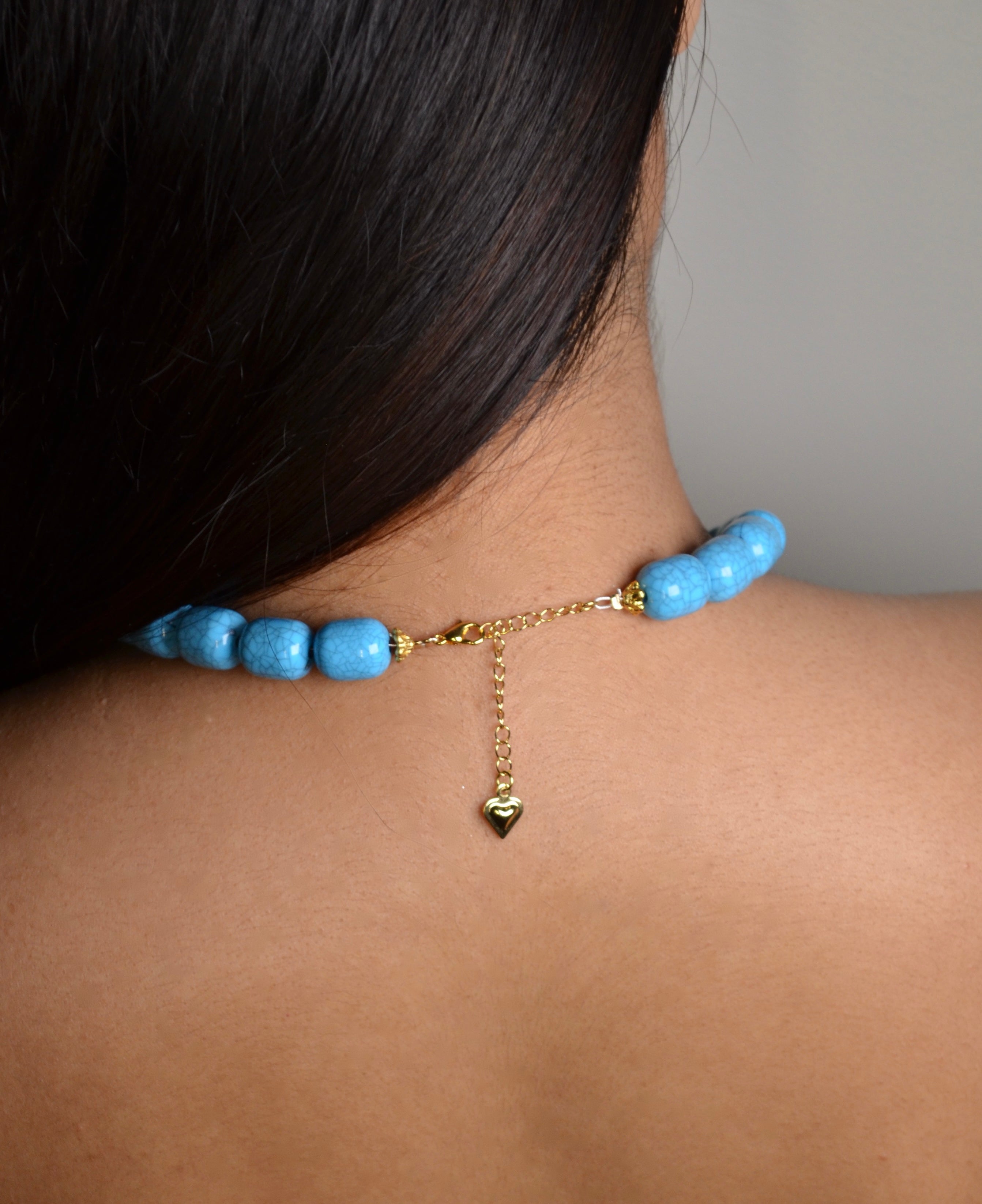 Turquoise beaded necklace with heart pendant